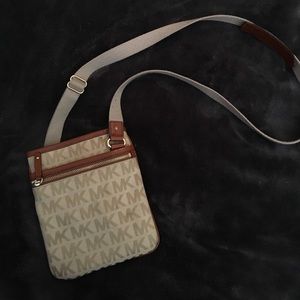 Tan & brown, over the shoulder Michael Kors purse.